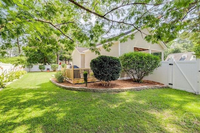 86 Fellwood Dr, Rincon, GA 31326 - fenced backyard with a gate and a deck
