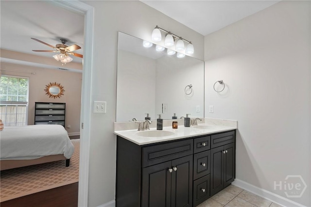 22 Carriage Way, Midway, GA 31320 - bathroom with double vanity, a ceiling fan, connected bathroom, and tile patterned flooring