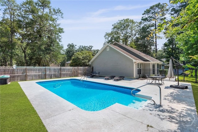 22 Carriage Way, Midway, GA 31320 - view of swimming pool with a patio, a fenced backyard, and view of scattered trees