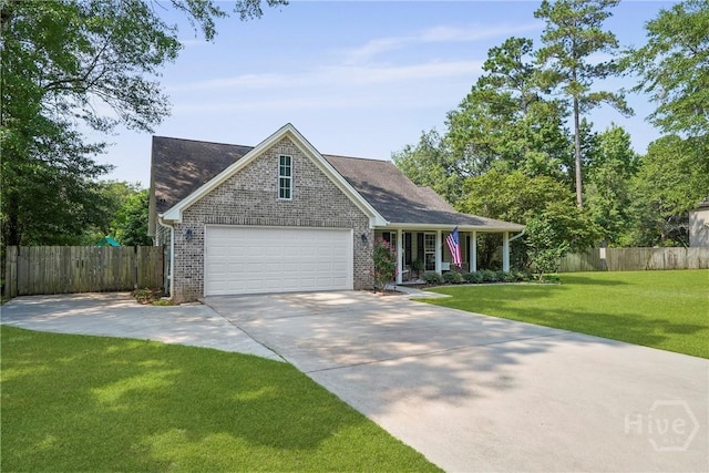 22 Carriage Way, Midway, GA 31320 - view of front of home with concrete driveway, brick siding, and covered porch