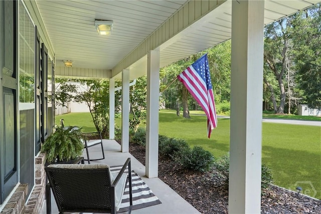 22 Carriage Way, Midway, GA 31320 - covered porch featuring a lawn