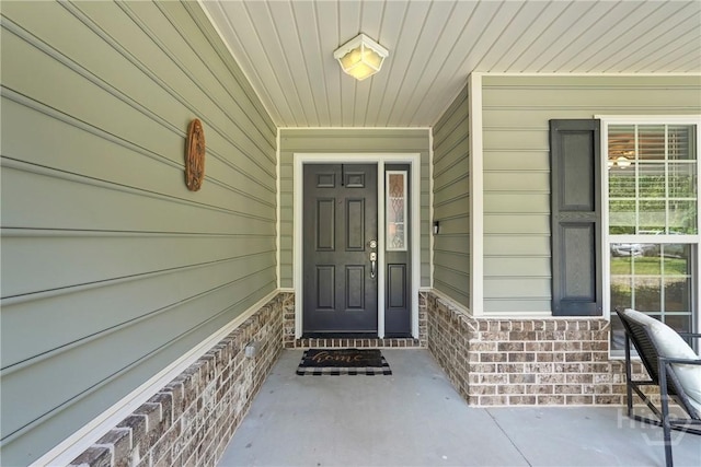22 Carriage Way, Midway, GA 31320 - doorway to property with covered porch