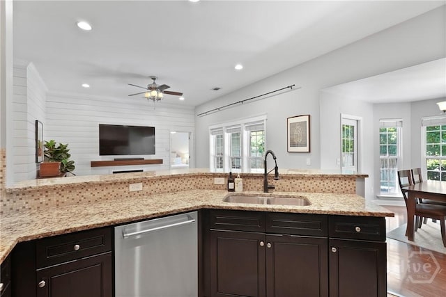 22 Carriage Way, Midway, GA 31320 - kitchen featuring stainless steel dishwasher, light stone countertops, open floor plan, ceiling fan, and recessed lighting