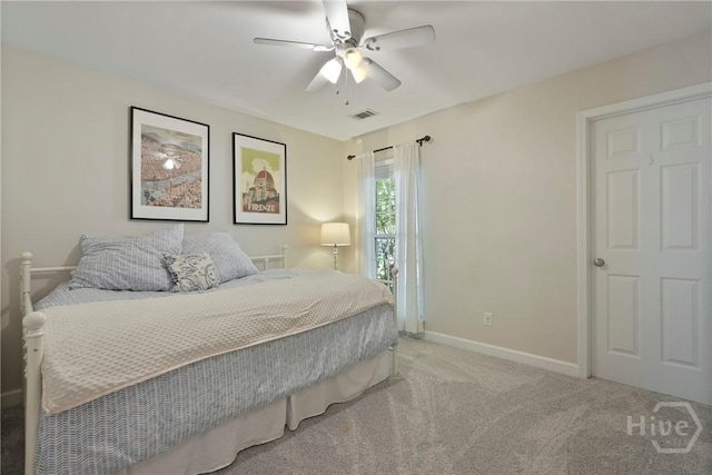 22 Carriage Way, Midway, GA 31320 - bedroom with light colored carpet and ceiling fan