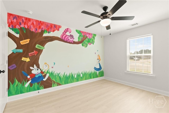 164 Whirlwind Way, Guyton, GA 31312 - spare room featuring wood finished floors, a ceiling fan, and a smoke detector