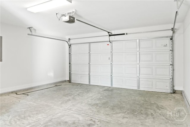 164 Whirlwind Way, Guyton, GA 31312 - garage featuring a garage door opener and baseboards