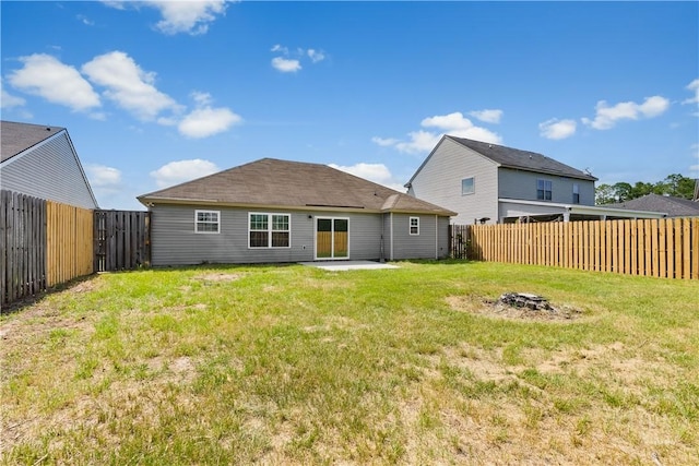 164 Whirlwind Way, Guyton, GA 31312 - back of property featuring a fire pit, a fenced backyard, and a patio