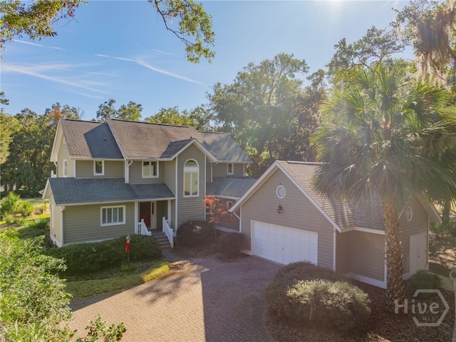 1 Hobcaw Ln, Savannah, GA 31411 - traditional-style home with an attached garage and decorative driveway