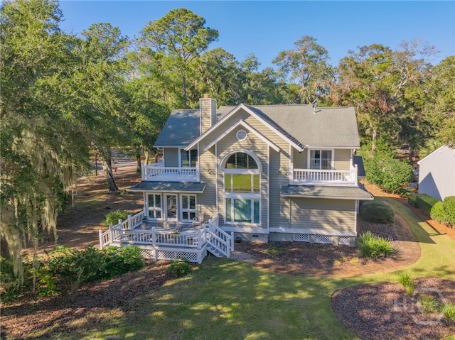 1 Hobcaw Ln, Savannah, GA 31411 - rear view of property featuring a balcony, a chimney, a yard, and a deck