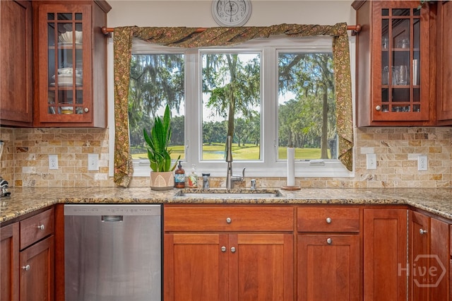 1 Hobcaw Ln, Savannah, GA 31411 - kitchen with stainless steel dishwasher, healthy amount of natural light, glass insert cabinets, and brown cabinetry