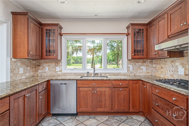 1 Hobcaw Ln, Savannah, GA 31411 - kitchen featuring stainless steel appliances, under cabinet range hood, brown cabinetry, light stone countertops, and a textured ceiling