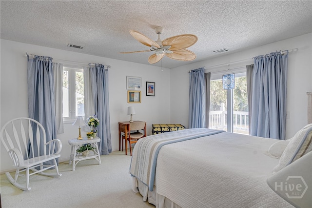 1 Hobcaw Ln, Savannah, GA 31411 - bedroom featuring access to outside, light colored carpet, a textured ceiling, and a ceiling fan