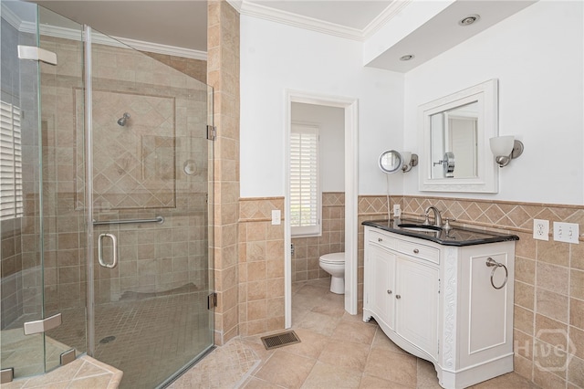 1 Hobcaw Ln, Savannah, GA 31411 - full bath featuring tile walls, ornamental molding, vanity, a stall shower, and tile patterned flooring