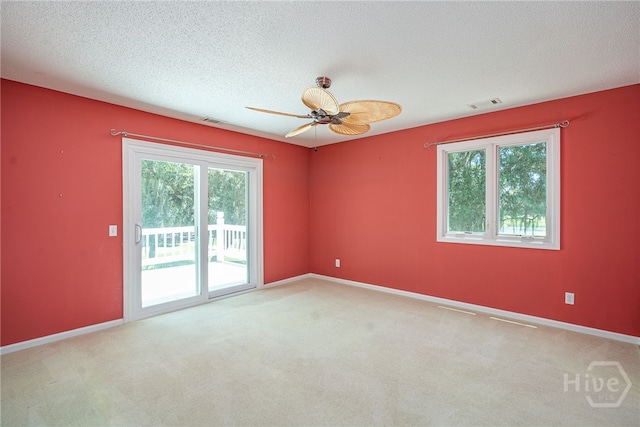 1 Hobcaw Ln, Savannah, GA 31411 - unfurnished room featuring plenty of natural light, carpet, a ceiling fan, and a textured ceiling
