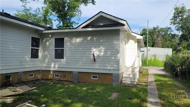 8-10 Mastick St, Savannah, GA 31404 - view of side of property with crawl space and a lawn