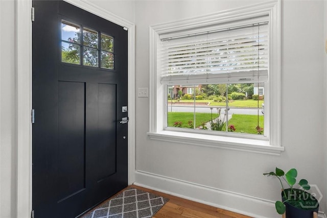540 E 60th St, Savannah, GA 31405 - foyer entrance with baseboards and wood finished floors