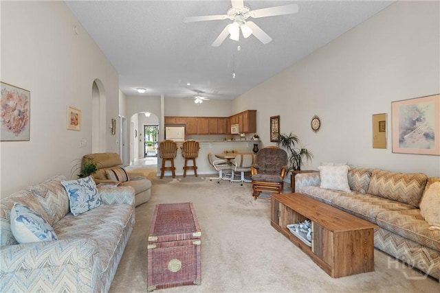 19 Travertine Cir, Savannah, GA 31419 - living room with arched walkways, ceiling fan, and light carpet