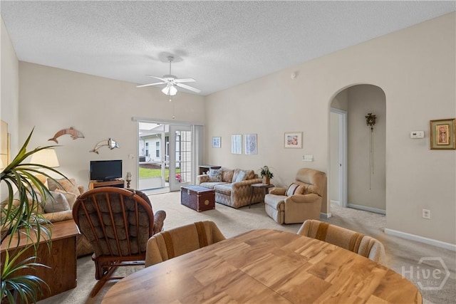 19 Travertine Cir, Savannah, GA 31419 - dining room with light carpet, arched walkways, a ceiling fan, and a textured ceiling