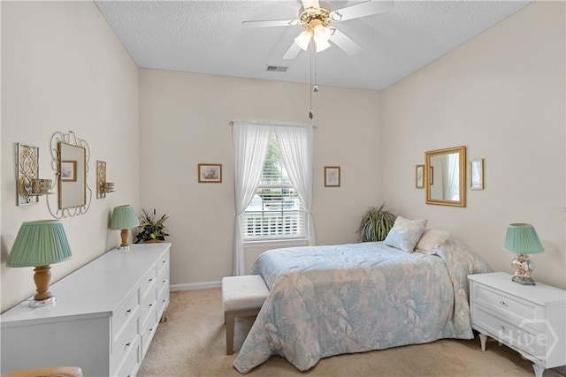19 Travertine Cir, Savannah, GA 31419 - bedroom with light colored carpet, a textured ceiling, and a ceiling fan