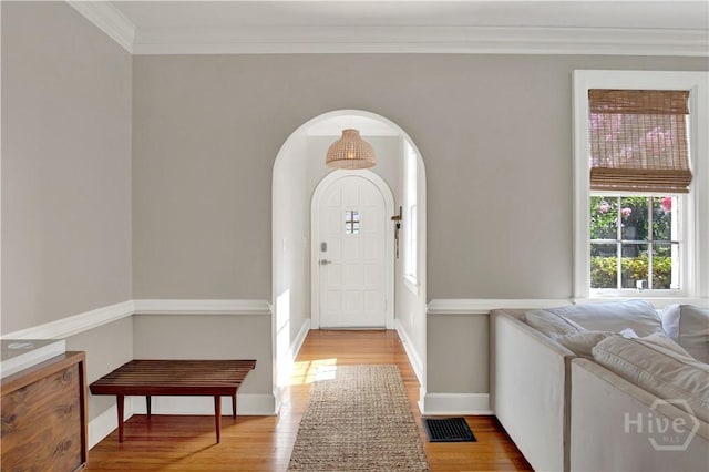 1406 E 50th St, Savannah, GA 31404 - entryway with wood finished floors, crown molding, and arched walkways