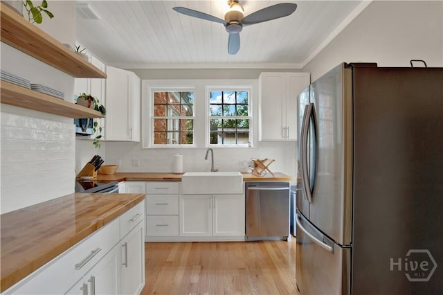 1406 E 50th St, Savannah, GA 31404 - kitchen with appliances with stainless steel finishes, wooden counters, open shelves, white cabinets, and wood ceiling