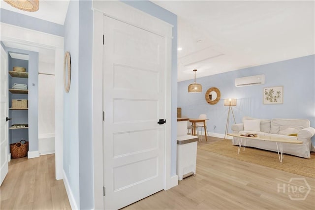 1406 E 50th St, Savannah, GA 31404 - hall featuring an AC wall unit and light wood-style flooring