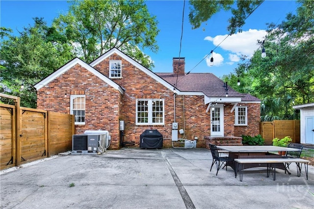 1406 E 50th St, Savannah, GA 31404 - back of house with brick siding, a chimney, a patio area, and outdoor dining area