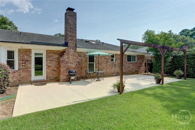 22 Red Fox Dr, Savannah, GA 31419 - back of property with brick siding, a chimney, a patio, and roof with shingles