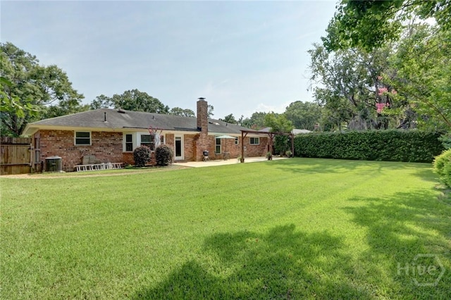 22 Red Fox Dr, Savannah, GA 31419 - back of property featuring a chimney, a patio area, and brick siding