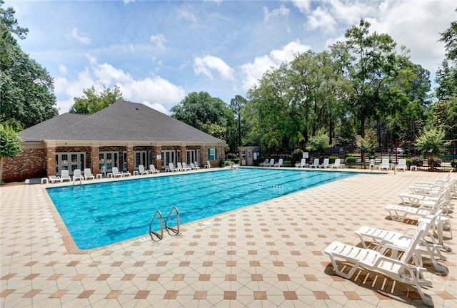 22 Red Fox Dr, Savannah, GA 31419 - community pool featuring a patio and view of scattered trees