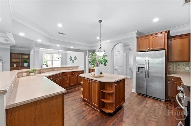 2604 River Oaks Dr Unit 2604, Richmond Hill, GA 31324 - kitchen with stainless steel fridge with ice dispenser, a large island with sink, range, dark wood-style floors, and recessed lighting