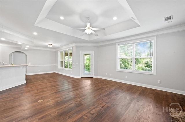 2604 River Oaks Dr Unit 2604, Richmond Hill, GA 31324 - unfurnished living room with a tray ceiling, healthy amount of natural light, a ceiling fan, dark wood-type flooring, and recessed lighting