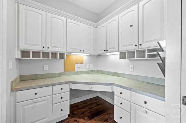 2604 River Oaks Dr Unit 2604, Richmond Hill, GA 31324 - kitchen with built in study area, white cabinets, dark wood finished floors, and light countertops