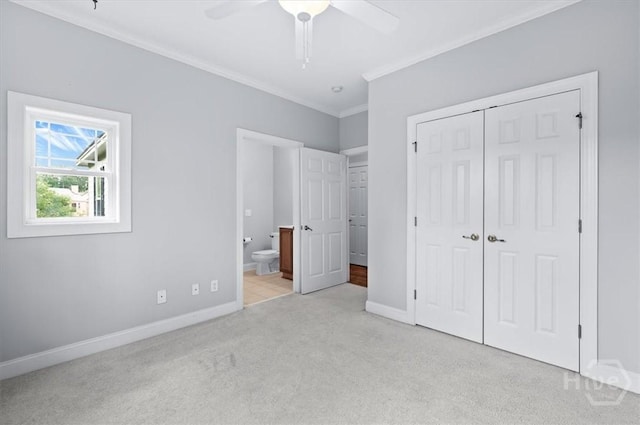 2604 River Oaks Dr Unit 2604, Richmond Hill, GA 31324 - unfurnished bedroom with crown molding, carpet, a closet, ensuite bathroom, and a ceiling fan