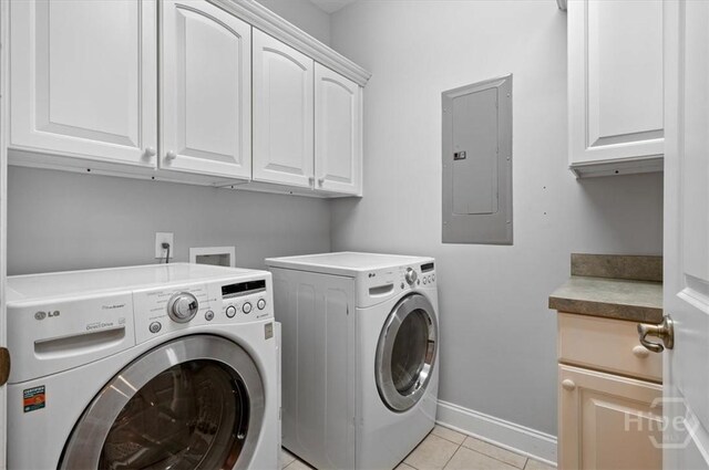 2604 River Oaks Dr Unit 2604, Richmond Hill, GA 31324 - laundry room with electric panel, cabinet space, washing machine and dryer, and light tile patterned floors