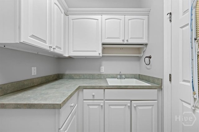 2604 River Oaks Dr Unit 2604, Richmond Hill, GA 31324 - kitchen featuring white cabinetry and light countertops