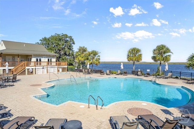 2604 River Oaks Dr Unit 2604, Richmond Hill, GA 31324 - community pool featuring a patio, a water view, and stairs