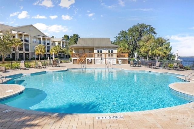 2604 River Oaks Dr Unit 2604, Richmond Hill, GA 31324 - community pool with a patio area