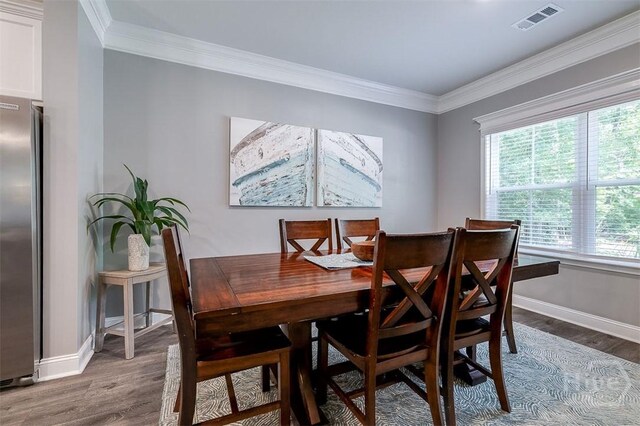 1652 Belle Island Rd, Richmond Hill, GA 31324 - dining room with wood finished floors and crown molding
