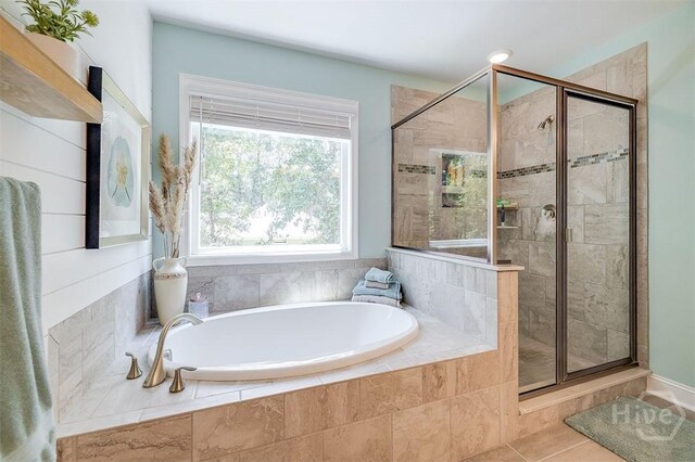 1652 Belle Island Rd, Richmond Hill, GA 31324 - full bathroom featuring a bath, a shower stall, and tile patterned flooring