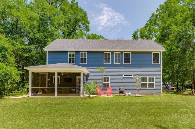 1652 Belle Island Rd, Richmond Hill, GA 31324 - rear view of house with a lawn and a sunroom