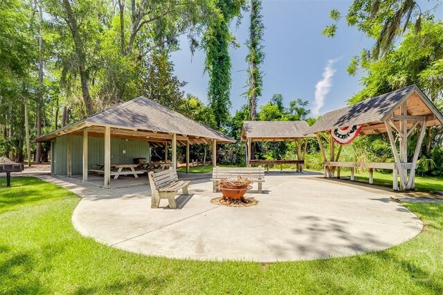 1652 Belle Island Rd, Richmond Hill, GA 31324 - surrounding community with a gazebo, a fire pit, a yard, and a patio