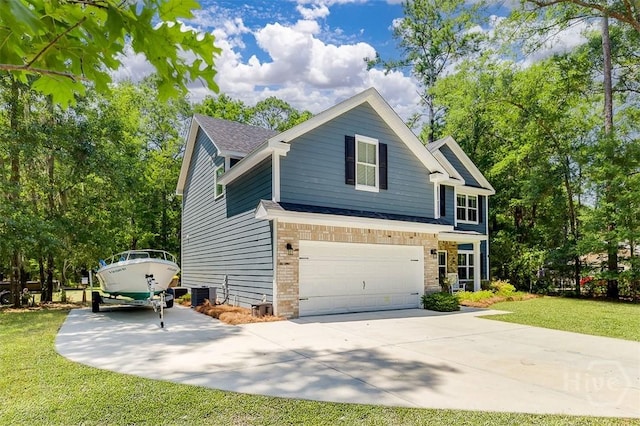 1652 Belle Island Rd, Richmond Hill, GA 31324 - view of front of house with driveway, a front yard, a garage, and brick siding