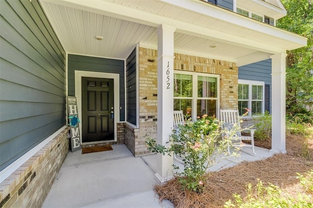 1652 Belle Island Rd, Richmond Hill, GA 31324 - entrance to property with brick siding and a porch