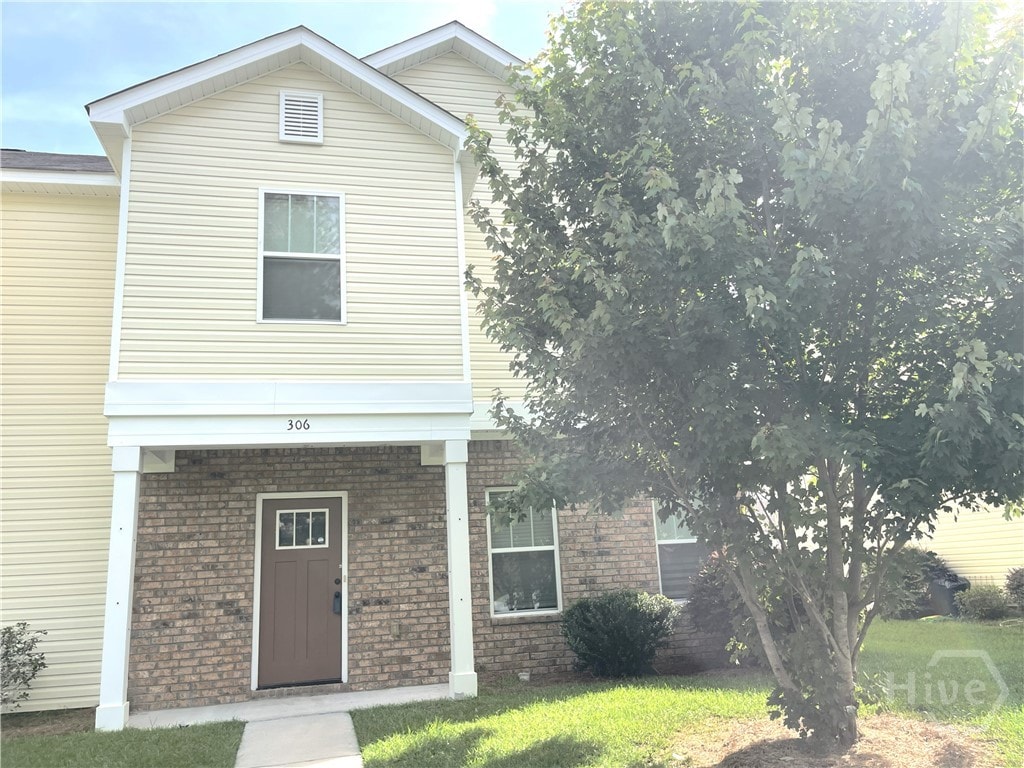 306 Morgan Pines Dr, Pooler, GA 31322 - view of front facade with brick siding and a front lawn