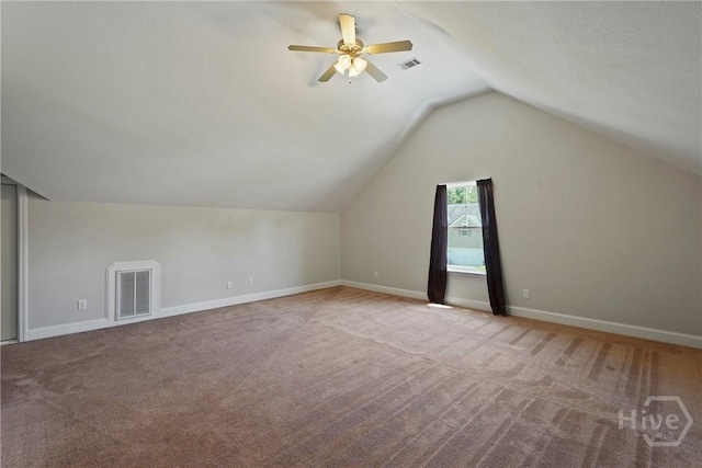 1226 Peacock Trl, Hinesville, GA 31313 - additional living space featuring carpet floors, vaulted ceiling, and a ceiling fan