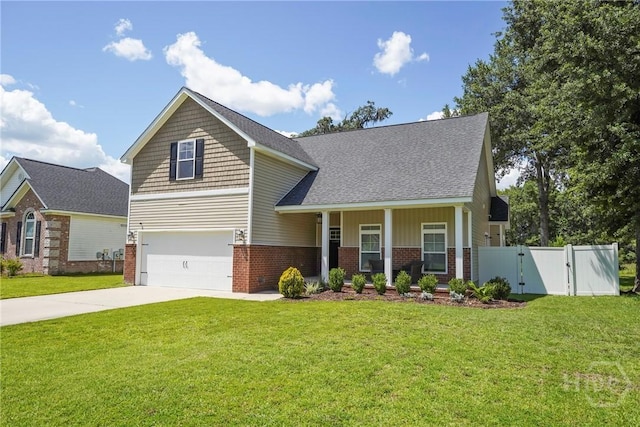 1226 Peacock Trl, Hinesville, GA 31313 - craftsman inspired home featuring brick siding, a gate, an attached garage, concrete driveway, and covered porch