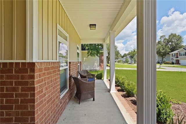 1226 Peacock Trl, Hinesville, GA 31313 - porch featuring a lawn
