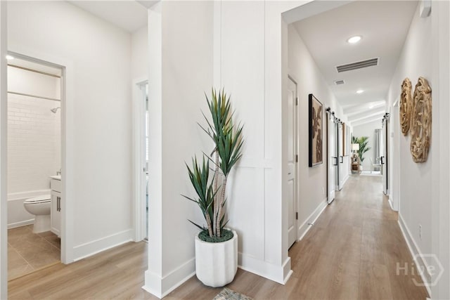 117 Mage St, Savannah, GA 31302 - hallway with light wood-style flooring and recessed lighting
