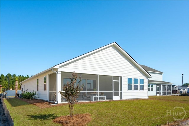 117 Mage St, Savannah, GA 31302 - rear view of house featuring a sunroom and a yard